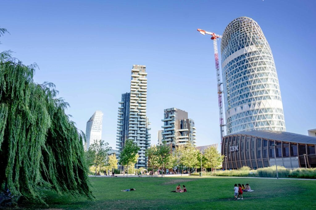 Vibrant cityscape of Milan's CityLife district showcasing modern skyscrapers and urban park.