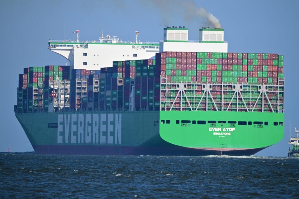 A colossal Evergreen container ship sails in Cuxhaven, Germany.