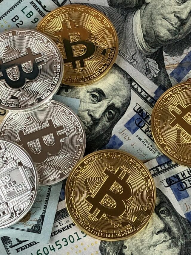 Close-up of bitcoins and US dollar bills symbolizing modern finance and cryptocurrency.